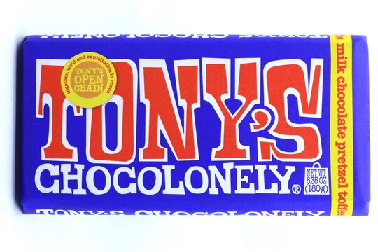 Large bar of Tony's milk chocolate on white background