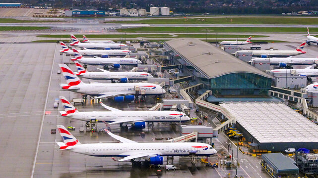 London, Middlesex, England, UK - 9 January 2026: Aerial view of a row of British Airways planes parlked at Terminal 5 at Heathrow Airport.