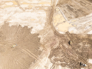 Aerial view of a large construction site showing earthmoving equipment working on a vast area of...