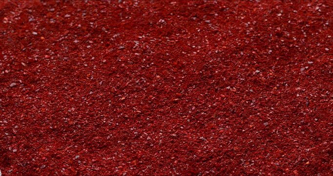 Gochugaru, Korean chili pepper seedless flakes background texture. An important ingredient in kimchi and gochujang paste. Selective focus.