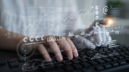 Detailed image of hands typing on a keyboard, overlaid with dynamic data graphs and analytics,...