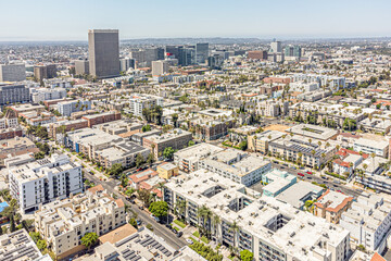Fototapeta premium Los Angeles, California, Los Angeles County - July 17, 2024: Aerial Drone Los Angeles Koreatown View Photo toward Vermont Ave, 4th St, Kenmore Ave with Apartment, House, Home, Town, Street, Road, City