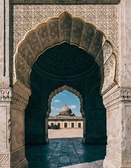 Ornate Archway Looking Towards a Dome Mosque Building