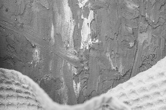 Waffle gray towel on gray textured background. Space for text.