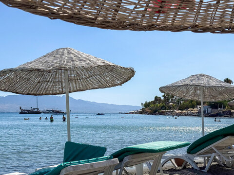 Tranquil Beach Scene with Umbrellas and Loungers
