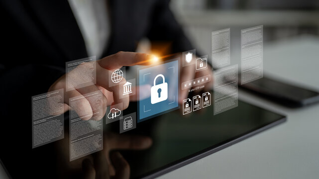 A business professional interacts with a tablet showcasing digital security visuals, emphasizing data protection and cybersecurity in a modern work environment. Gantry