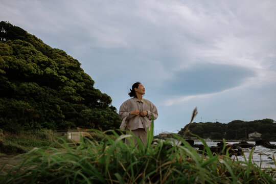 A woman anticipating the future in the wind.
