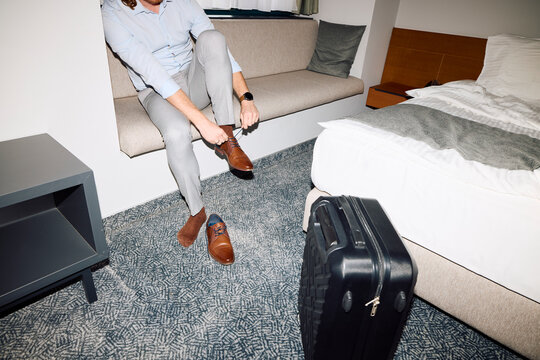 Man prepares to leave hotel room
