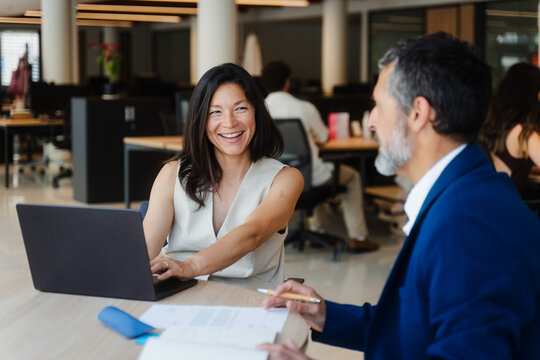 Man and woman working together at a desk