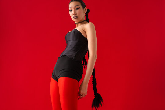 Woman with trendy fashion braids hairstyle studio fashion portrait