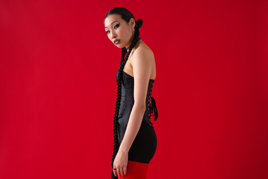 Fashionable Woman on Red Background