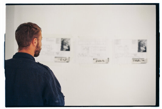 Worker checking plans at construction site