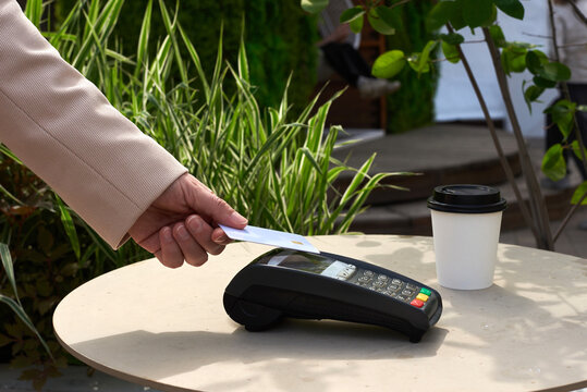 Person paying with a card 