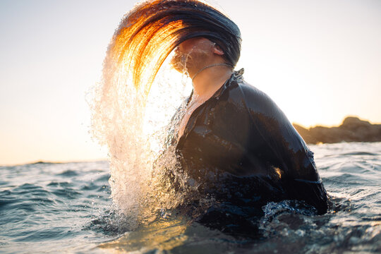 Water Splash and Hair Flip at Sunset on the Beach