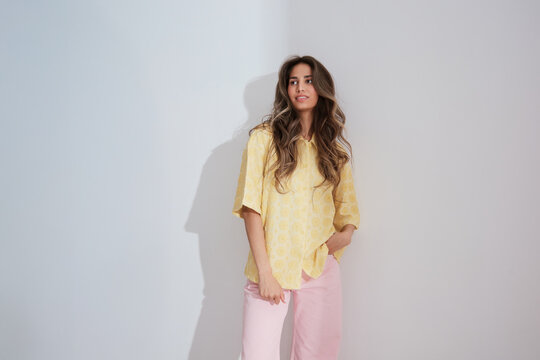Woman in yellow shirt sun portrait