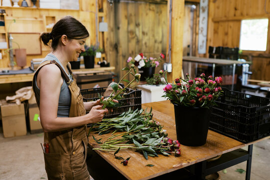 small business entrepreneur working and making flower bunches