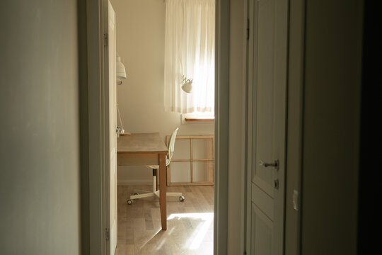 Bright Minimalist Office with Wooden Floor
