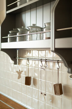 Glass Jars and Decorative Hooks in Kitchen
