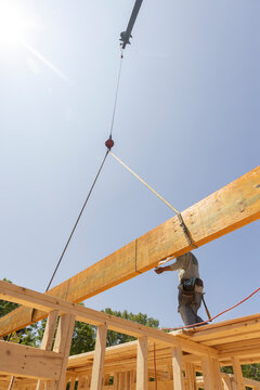 Home Construction wooden beam install