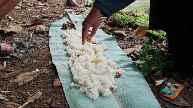 Traditional Indonesian Nasi Liwet Feast Served on Fresh Banana Leaf Outdoors