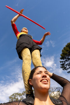 Performers Showcase Balancing Skills in Outdoor Park