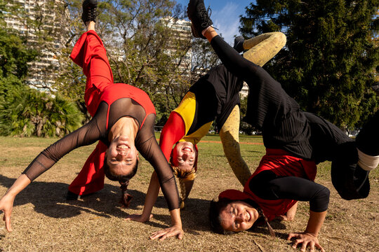 Performing Acrobatic Moves in a Sunny Park Setting
