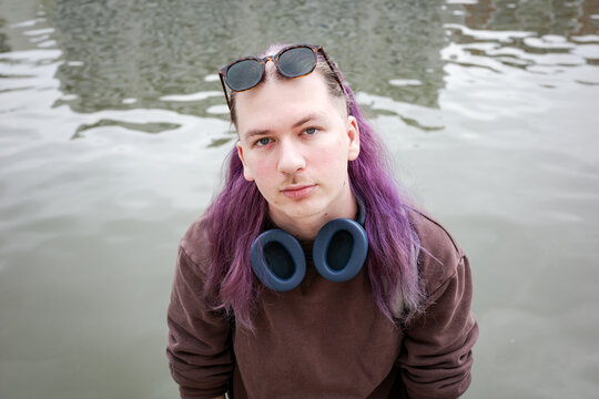 Centralized portrait of a man's face in front of water