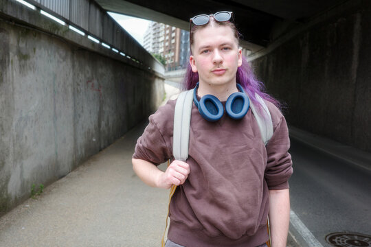 Young Person walking in Urban Underpass Setting
