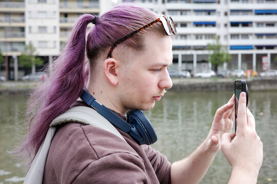 Profile portrait of a Young man Taking Photos 