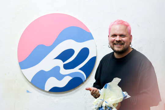 Positive happy artist Celebrating his Creative artwork