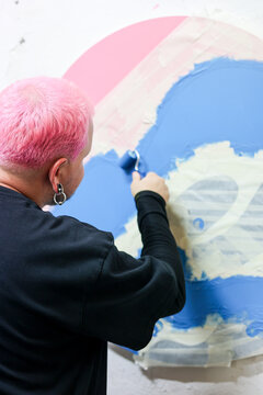 Painter Transforms Wall With Blue and Pink Circular Artwork 