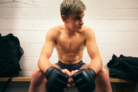 MMA fighter resting in the locker room