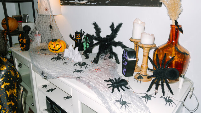 Decorative Halloween Display With Spiders, Pumpkins, and Cobwebs