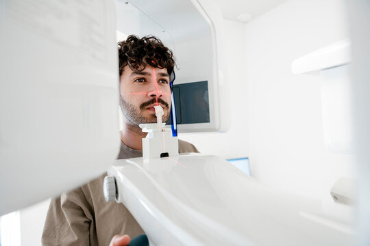 Patient undergoing dental x-ray examination in modern clinic