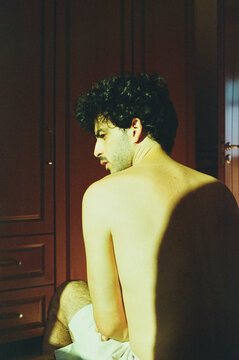 Moody portrait of a man with his back to the camera