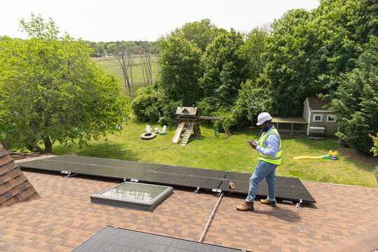 House Solar Panel technician  black worker 