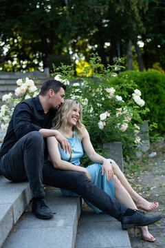 Romantic Couple Enjoying an Outdoor Moment Amidst Blooming Flowers