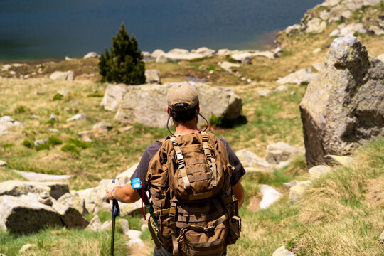 Backpacker Overlooking Mountain Lake