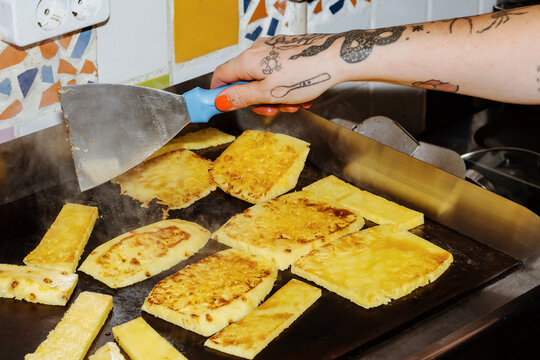Grilling Fresh Pineapple Slices in a Vibrant Kitchen Setting