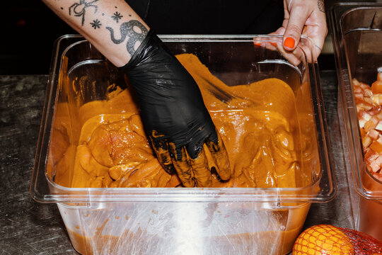 Preparing Flavorful Marinade in a Professional Kitchen Setting