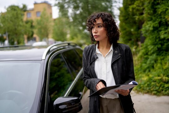 Real Estate Agent Arriving at Property