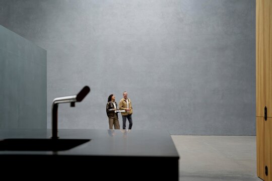 Modern Interior Space With Two People Exploring Minimal Design