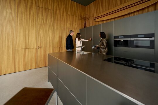 Kitchen consultation with clients in modern space