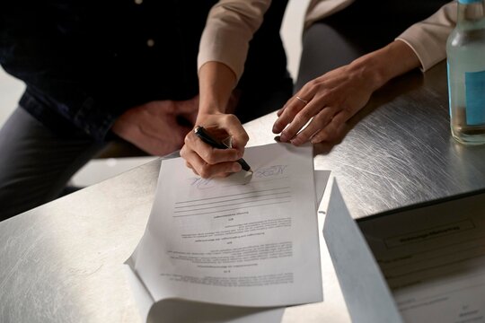 Signing important documents in a modern office setting