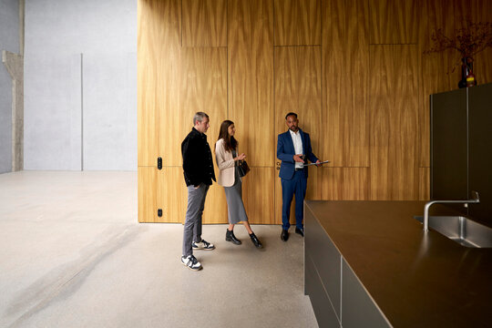 Professionals Discussing Plans in Modern Interior Space