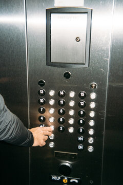 Pressing Hotel Elevator Button
