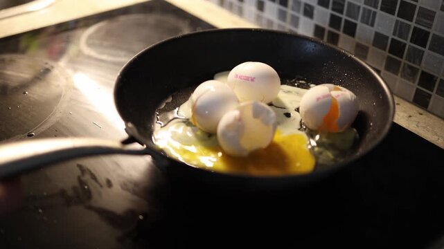 Eggs burn in hot pan as cracked shells sit on runny mess careless morning cooking mistake glowing stove surface and failed homemade breakfast attempt