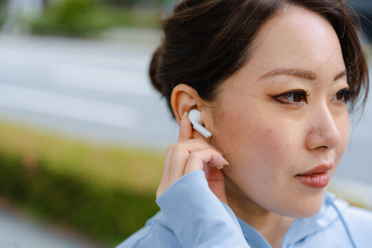 Woman's face with earphones