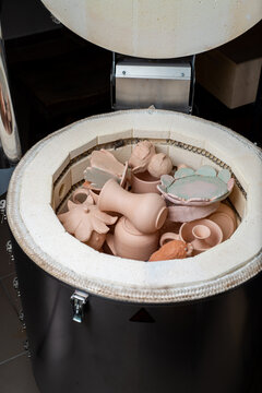 Finished clay products in a kiln in a pottery workshop