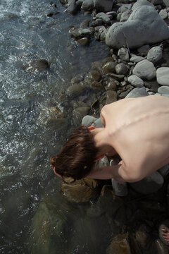A naked woman  at the river 